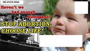 Postcards Featuring Abortion Victim Photo Spark Controversy in Kansas