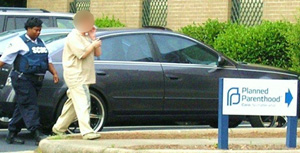 Photos Show Prison Guards Escorting Crying Female Inmate into Planned Parenthood