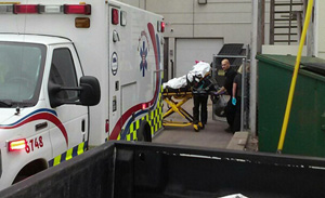 EMTs Extricate Woman from Abortion Facility into Back Alley Strewn with Trash Dumpsters